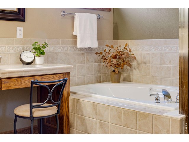 Property Photo 29 Added vanity area, elegance tile work throughout!