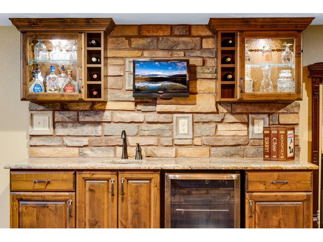 Property Photo 44 Gorgeous quality Alder cabinetry & slab granite, beverage fridge and integrated speakers.