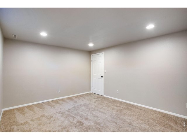 Property Photo 32 Spacious bedroom 4 measuring 14.6 X 11.8 with new egress window and walk-in closet