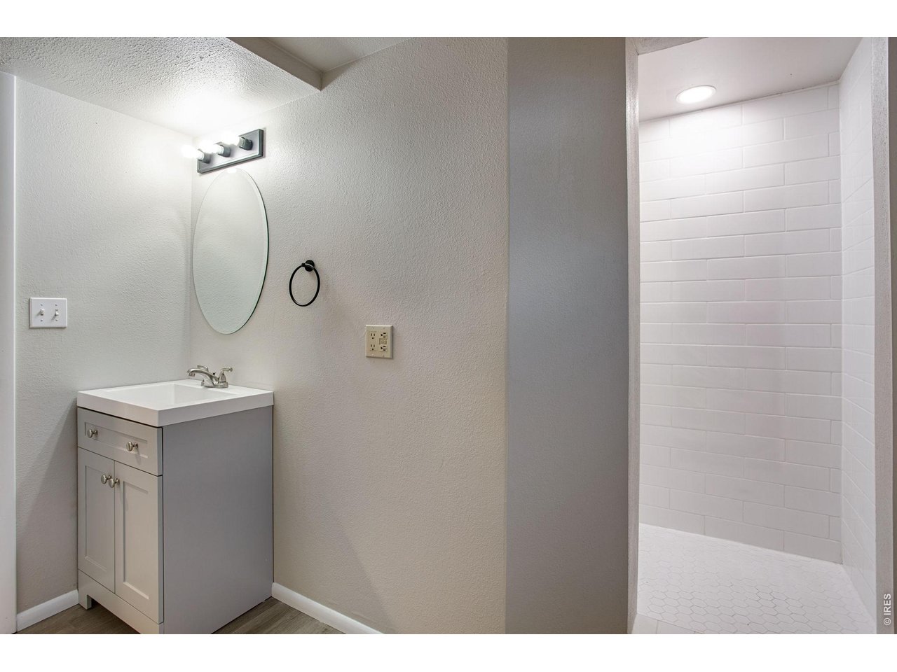 Property Photo 34 Remodeled bath with all new shower, tile, new toilet, new vanity, and new mirror