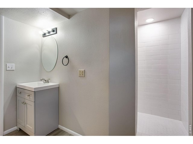 Property Photo 34 Remodeled bath with all new shower, tile, new toilet, new vanity, and new mirror