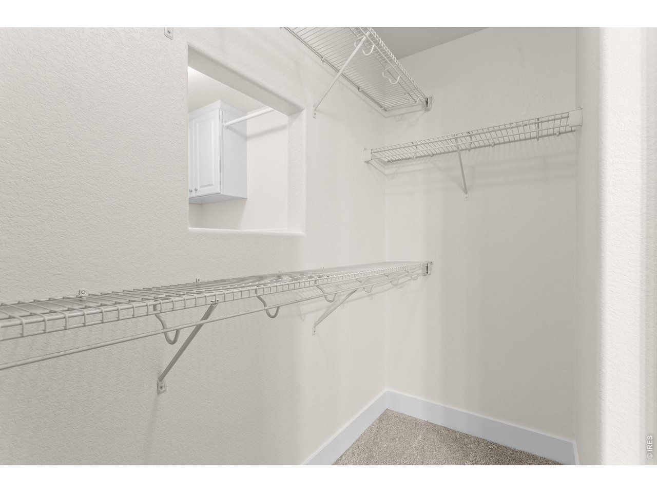 Property Photo 25 Primary Walk-In Closet