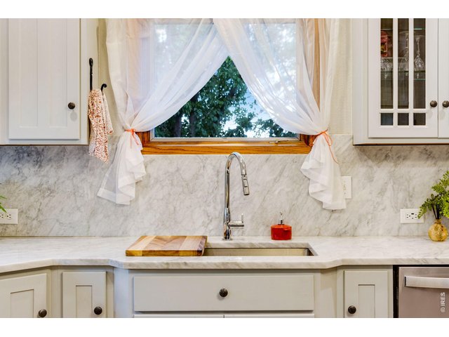 Property Photo 22 Carrara Marble all over- graces the entire perimeter/countertops and full height kitchen splash!