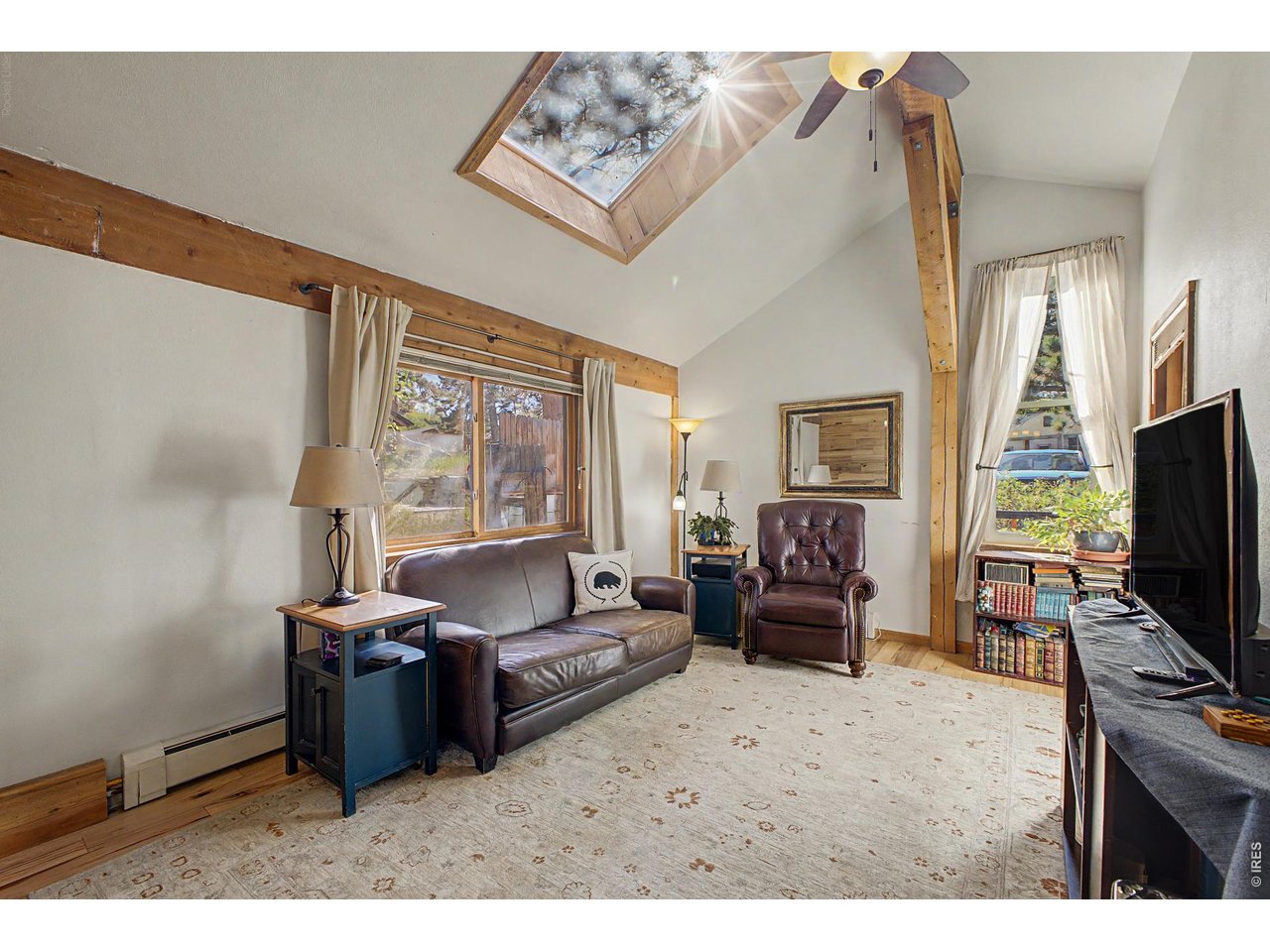 Property Photo 7 Bright Living Room w/ Vaulted Ceilings and Skylight