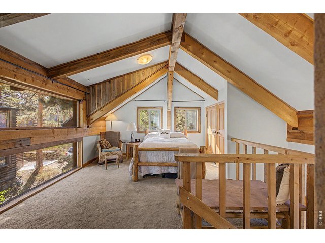 Property Photo 13 2nd Bedroom with Large Custom Windows