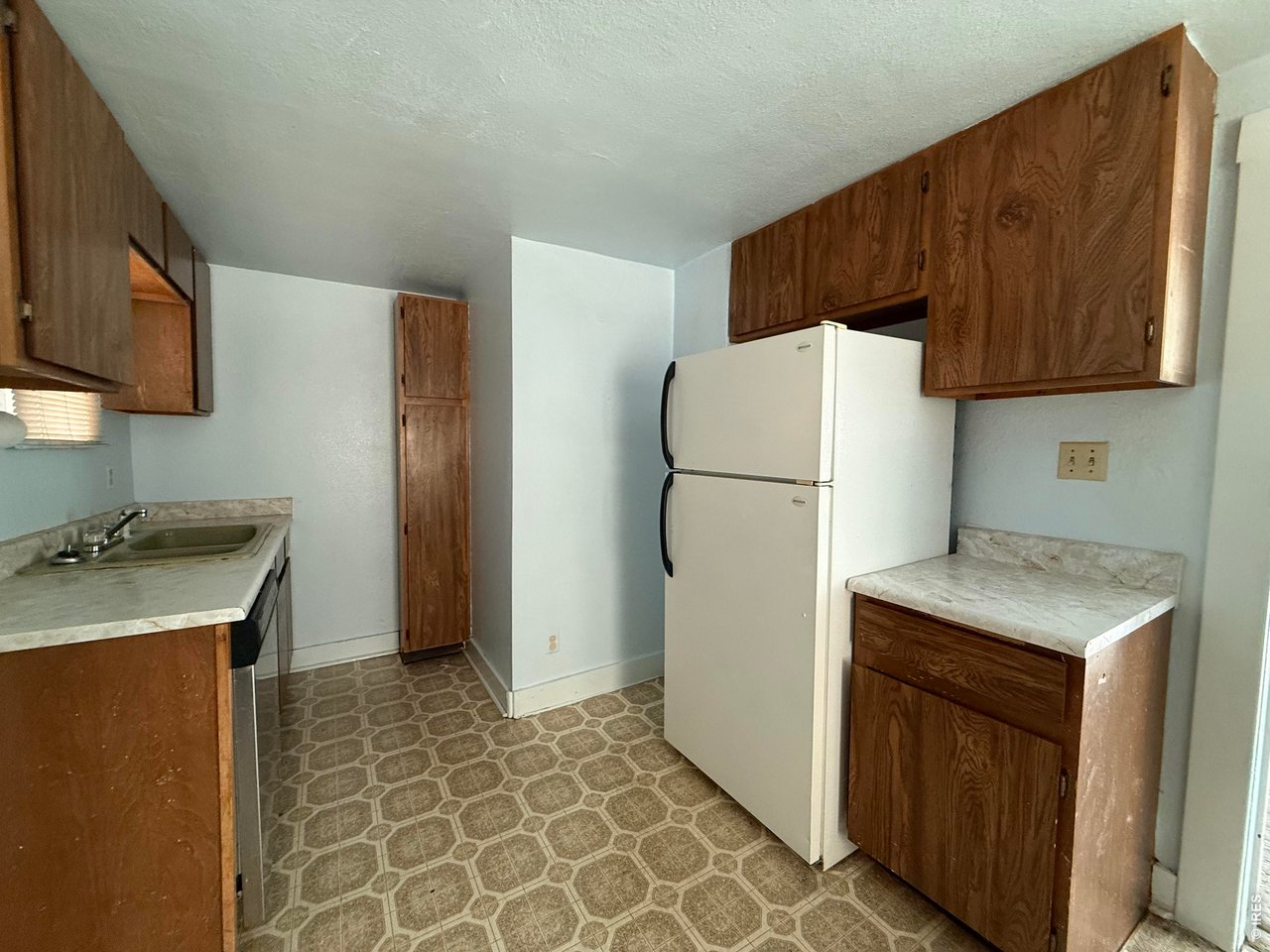 Property Photo 16 Kitchen with fridge