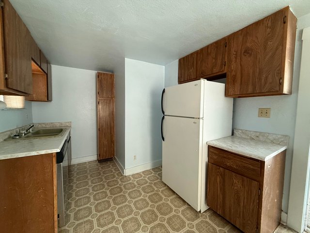 Property Photo 16 Kitchen with fridge