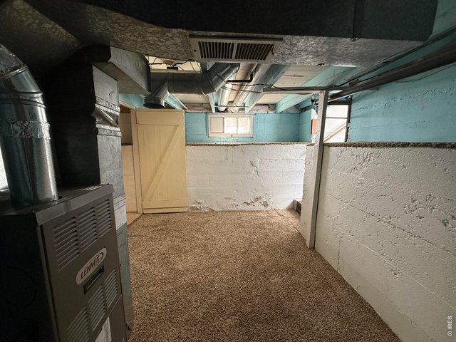 Property Photo 18 Basement is clean, painted and carpeted. However, it's not tall enough to stand in. Great for storage and houses the Furnace.