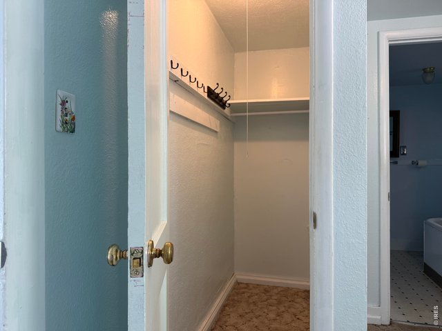Property Photo 13 Primary bedroom walk-in closet