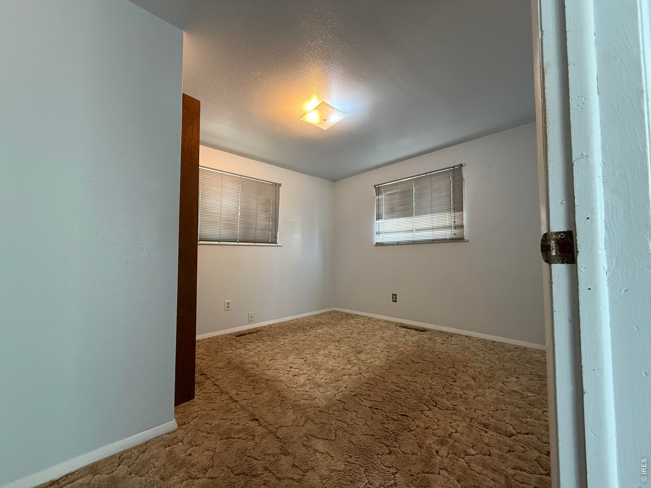 Property Photo 8 Bedroom 2- directly to the right of the Living Room