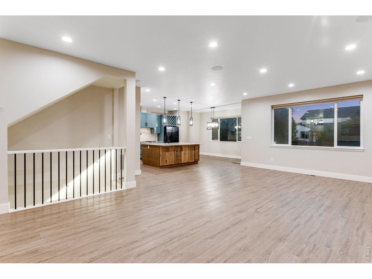 Property Photo 7 Spacious Foyer, open floor plan, white trim and luxury vinyl plank flooring on entire main level.