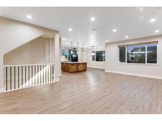 Property Photo 7 Spacious Foyer, open floor plan, white trim and luxury vinyl plank flooring on entire main level.