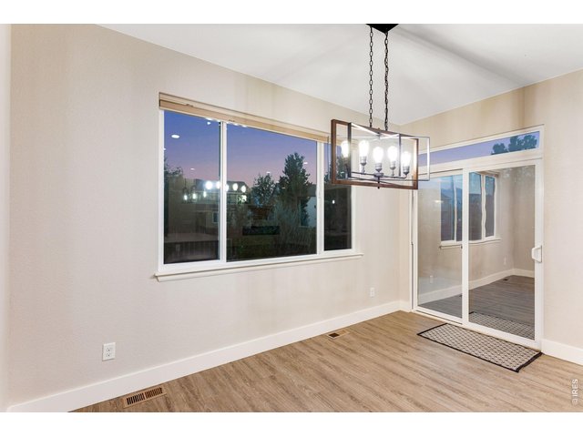 Property Photo 16 Spacious dining area with dimmer switch and patio access