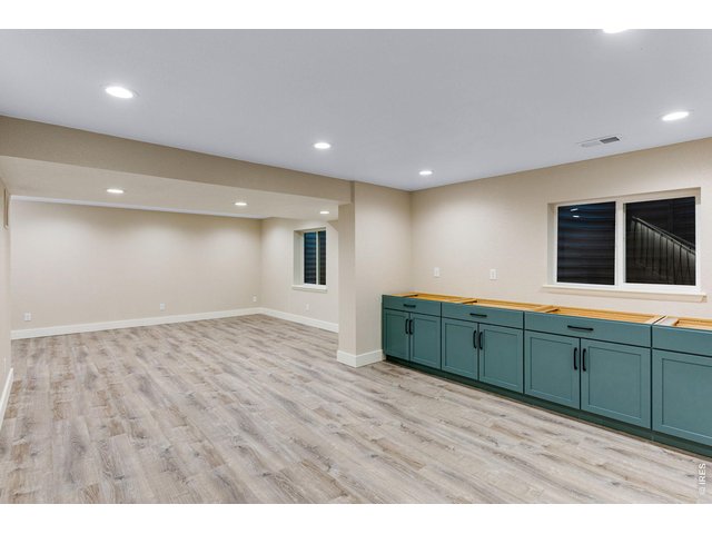 Property Photo 35 Wet bar with quartz countertop, garbage disposal, touchless faucet, wine cooler, microwave and refrigerate all included
