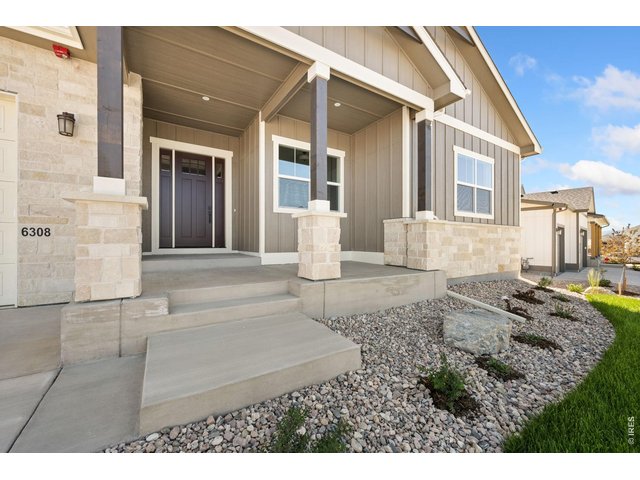 Property Photo 4 Welcoming front porch.