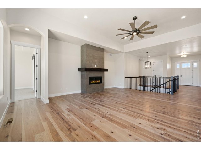 Property Photo 8 Linear Gas Fireplace with tile to ceiling