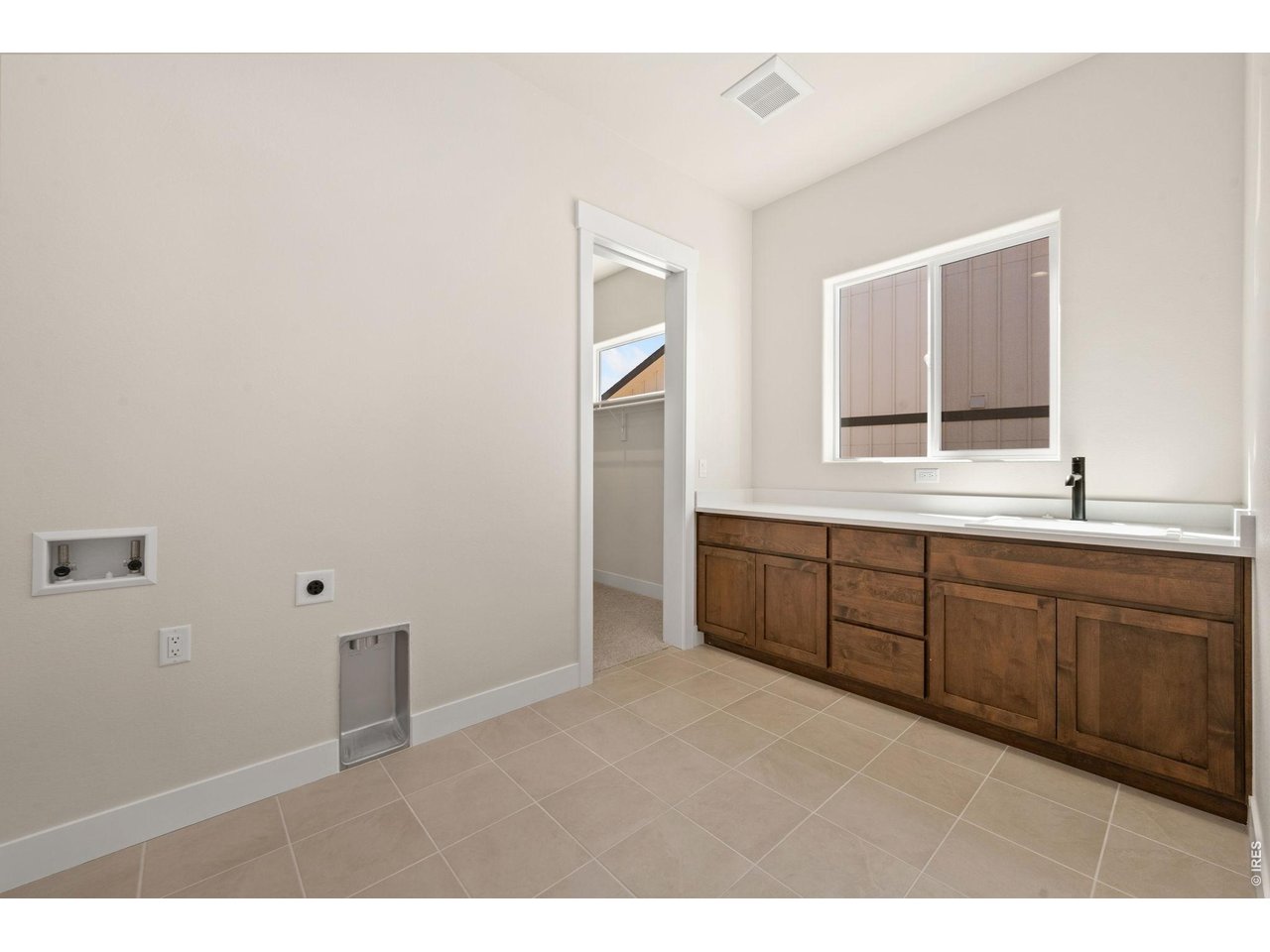 Property Photo 30 Main Floor Laundry with Utility Sink