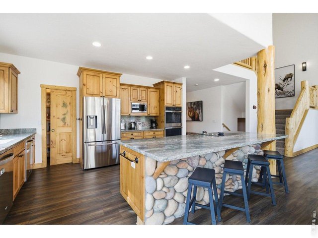 Property Photo 4 Open concept kitchen with oversized kitchen island perfect for entertaining