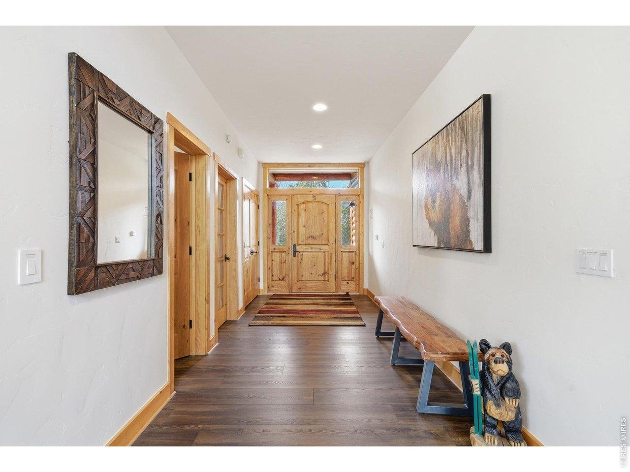 Property Photo 14 An inviting entry warm, welcoming and filled with mountain character- powder bath and 2nd bedroom-office