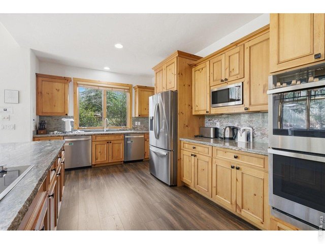 Property Photo 18 Beautifully updated kitchen with open flow to dining and great room