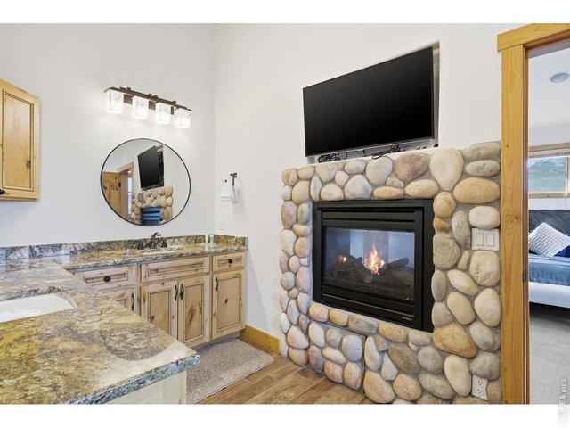 Property Photo 25 Soak in the warm fireplace in the upper primary en suite
