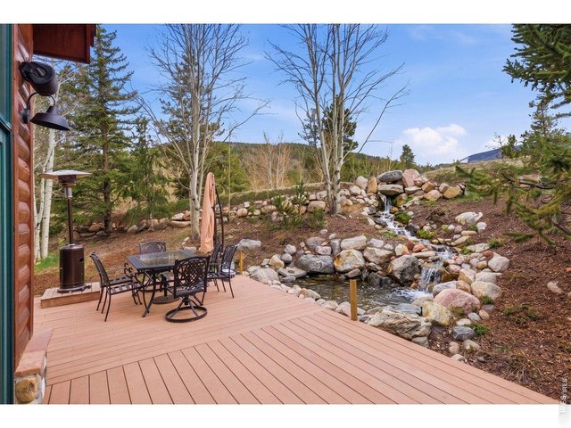 Property Photo 37 Off the deck enjoy the peaceful backyard waterfall and pond feature