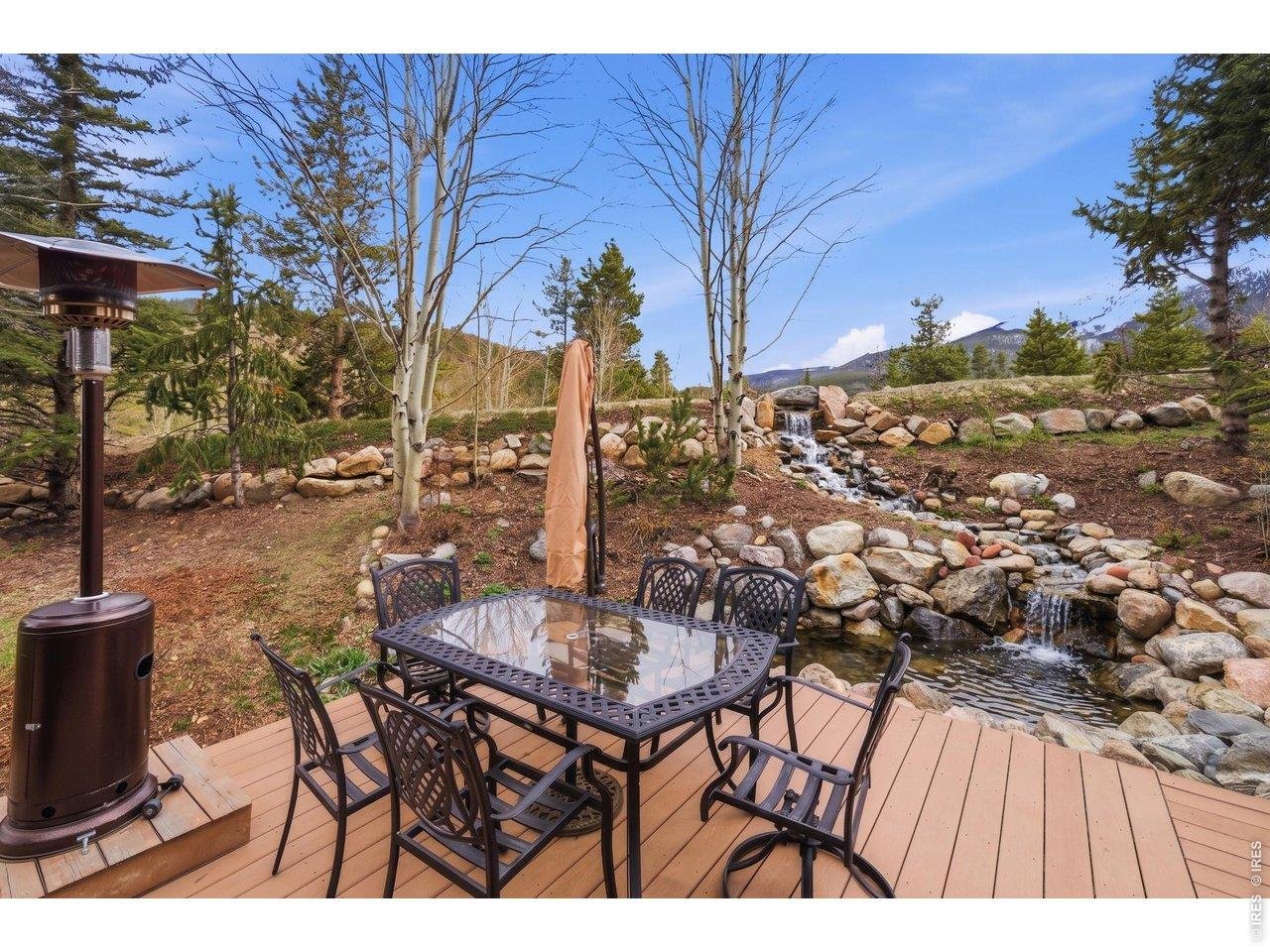 Property Photo 38 Off the deck enjoy the peaceful backyard waterfall and pond feature