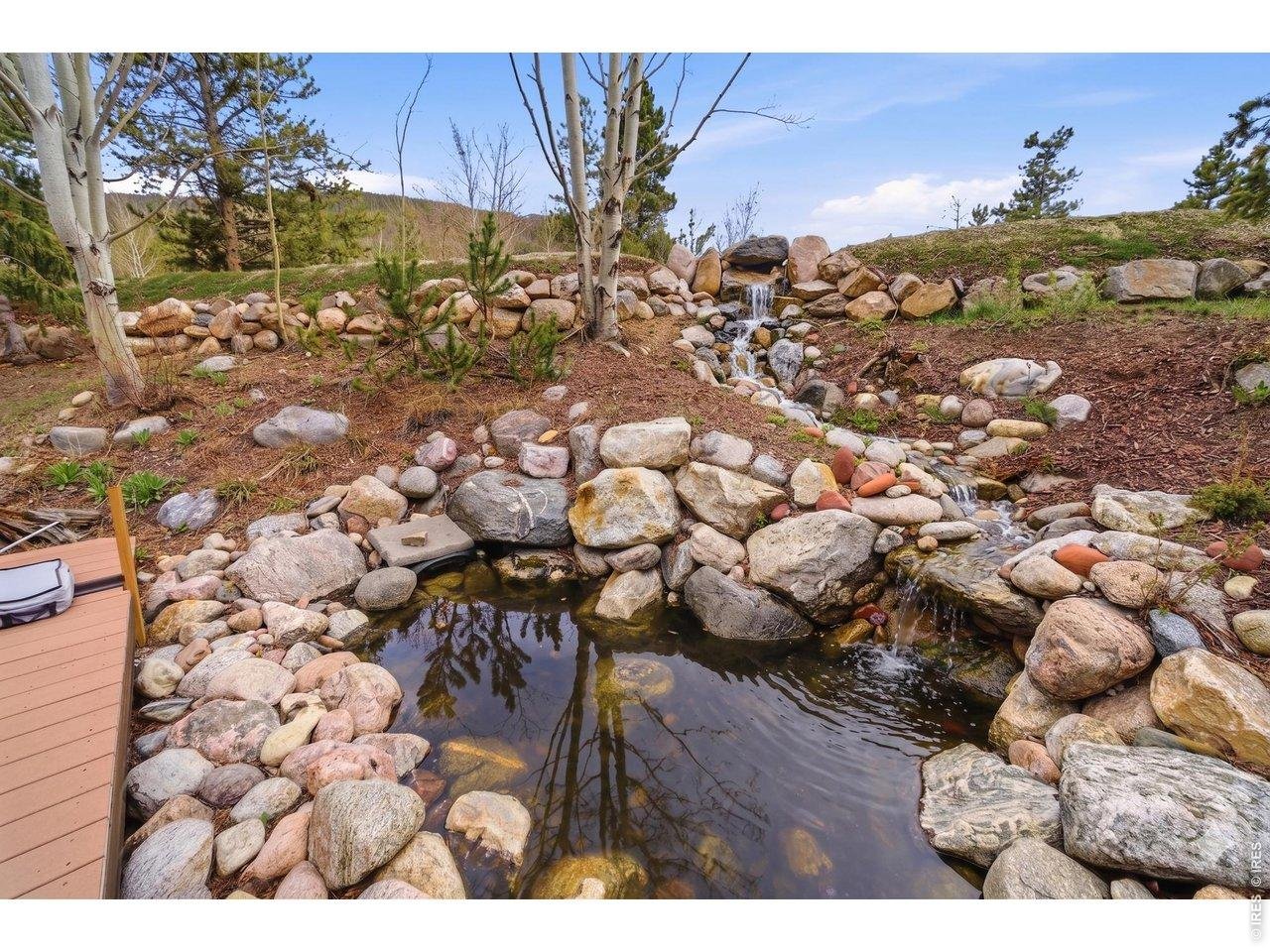 Property Photo 39 Enjoy the peaceful backyard waterfall and pond feature