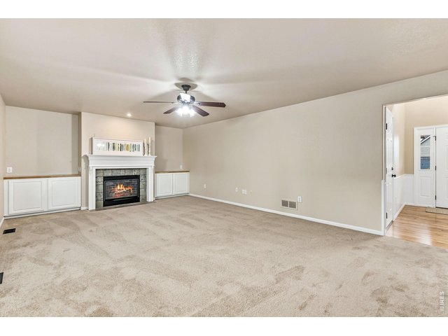 Property Photo 5 The slate-surround gas fireplace anchors the living area and can help create a cozy gathering place