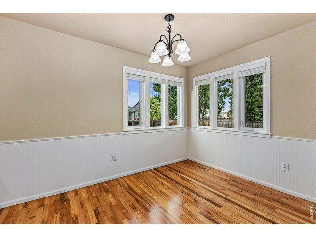 Property Photo 6 You are welcomed by elegant wainscoting, newly refinished solid hardwood floors, and an abundance of natural light