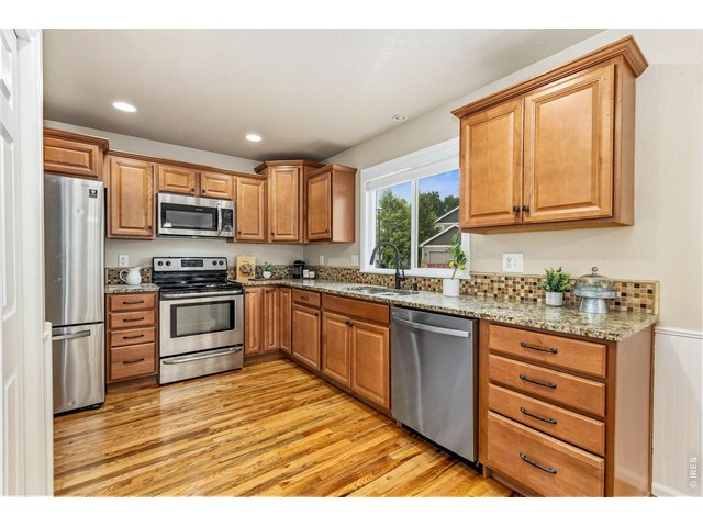 Property Photo 8 The kitchen has stainless steel appliances, granite counters and alder cabinetry