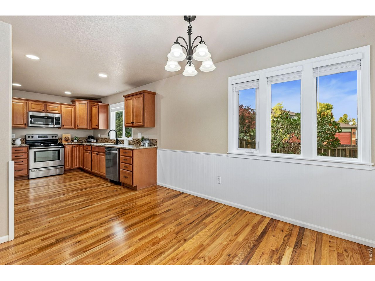 Property Photo 13 The heart of the home is a nice kitchen featuring granite countertops, alder cabinetry, tile backsplash, stainless steel appliances, pantry storage, and a casual dining area where mornings begin with coffee and evenings end with conversation