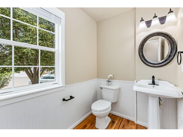 Property Photo 14 The main floor powder room is fresh and bright