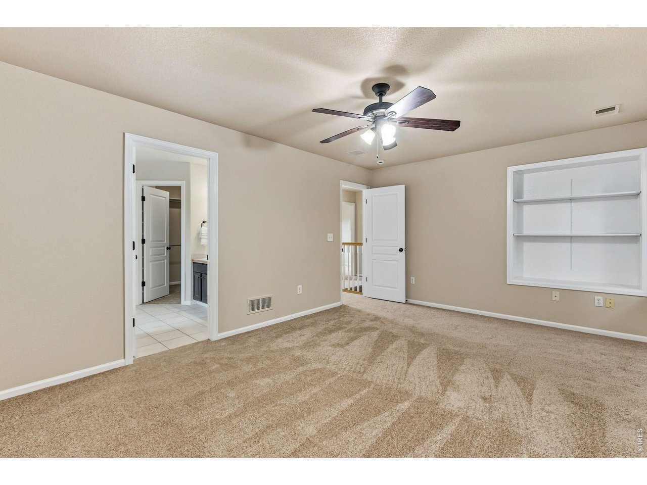 Property Photo 15 Upstairs, the private primary retreat offers the perfect place to unwind