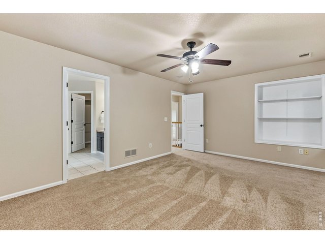 Property Photo 15 Upstairs, the private primary retreat offers the perfect place to unwind