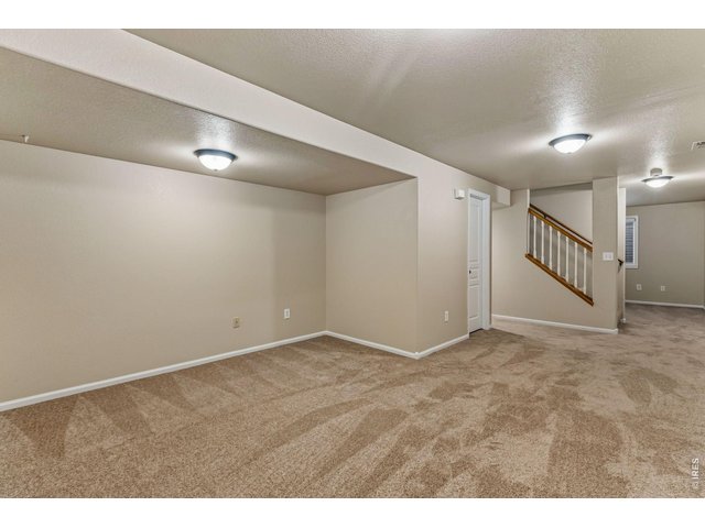 Property Photo 28 The finished basement expands your living possibilities with a fourth bedroom, full bath, dedicated office, and generous recreation room-ideal for guests, hobbies, working from home, or movie nights