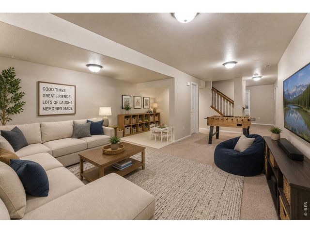 Property Photo 27 Imagine spending time with family and friends in the basement rec room! Virtually staged