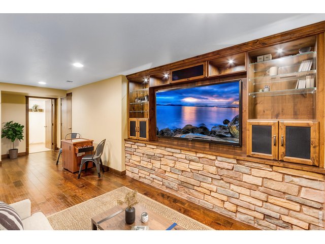 Property Photo 42 Theater and Media Room, 3D TV & full speaker system included! Stunning lower level finish by local Highcraft!