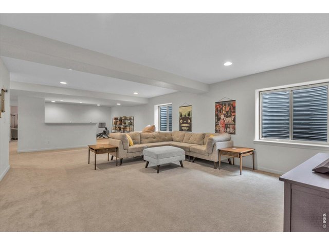 Property Photo 34 lower level entertaining space with wet bar, fridge, recessed lighting, egress windows (and extensive room for storage)