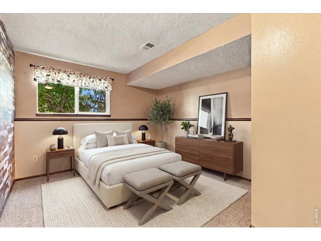 Property Photo 34 Second bedroom is on lower level virtual staged