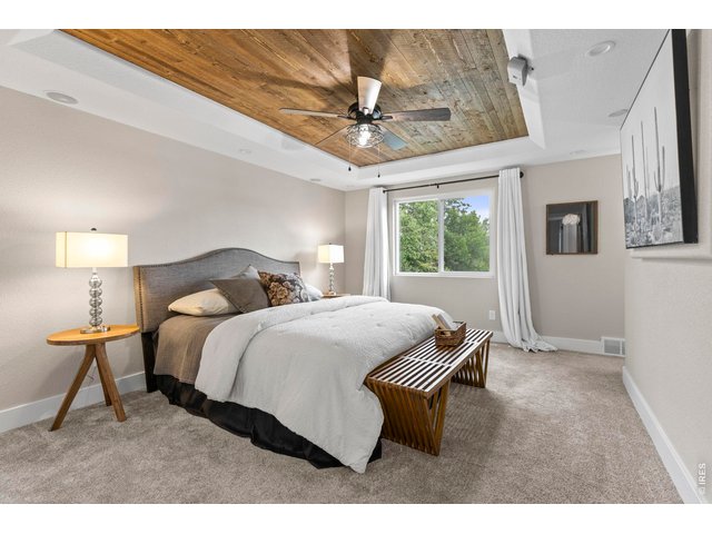 Property Photo 21 Primary Bedroom with Custom Wood Tray Ceiling