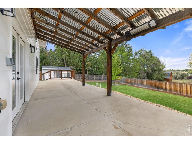 Property Photo 37 Fully Covered Patio with Cafe Lights