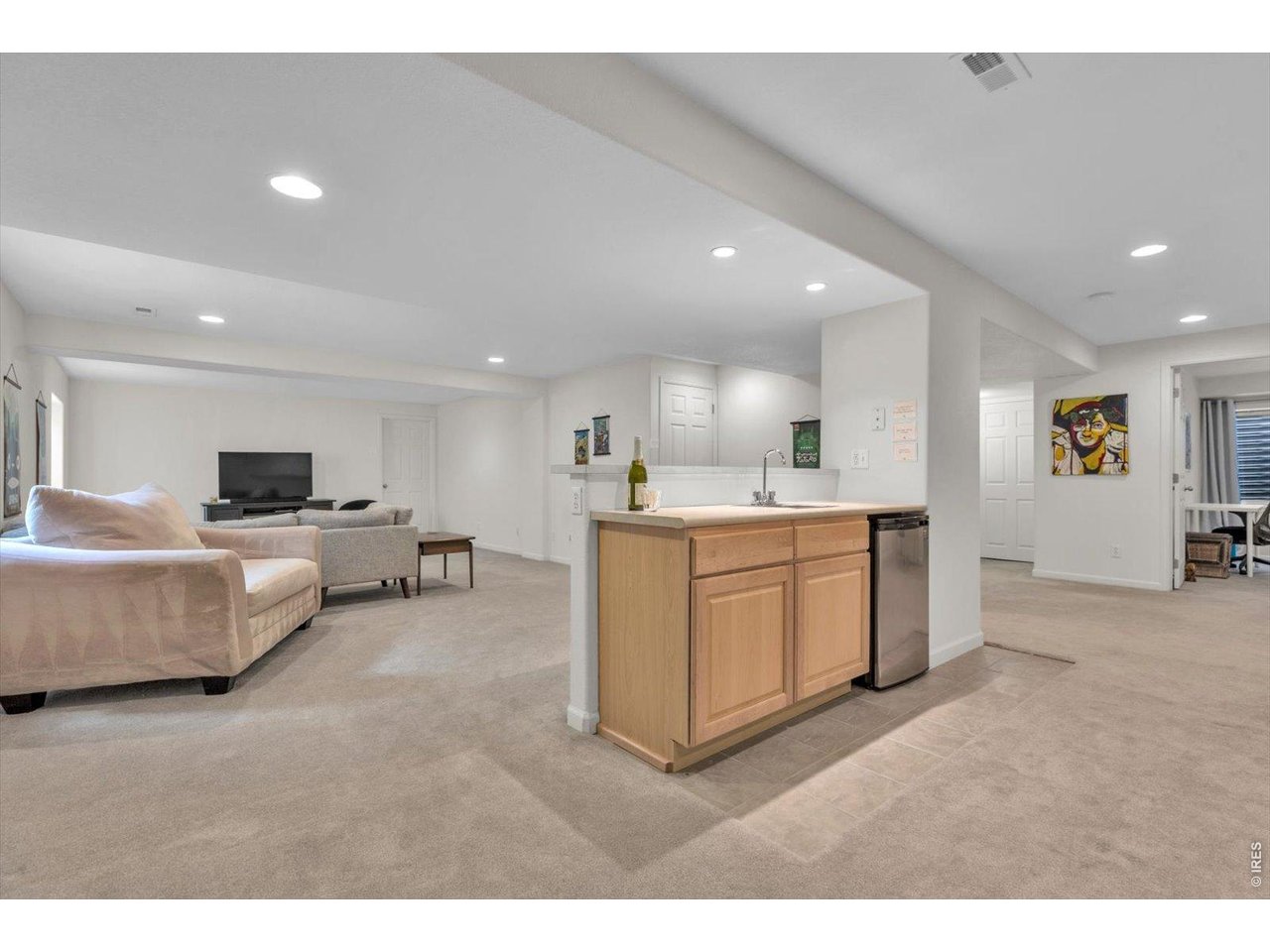 Property Photo 35 expansive lower level wet bar and fridge