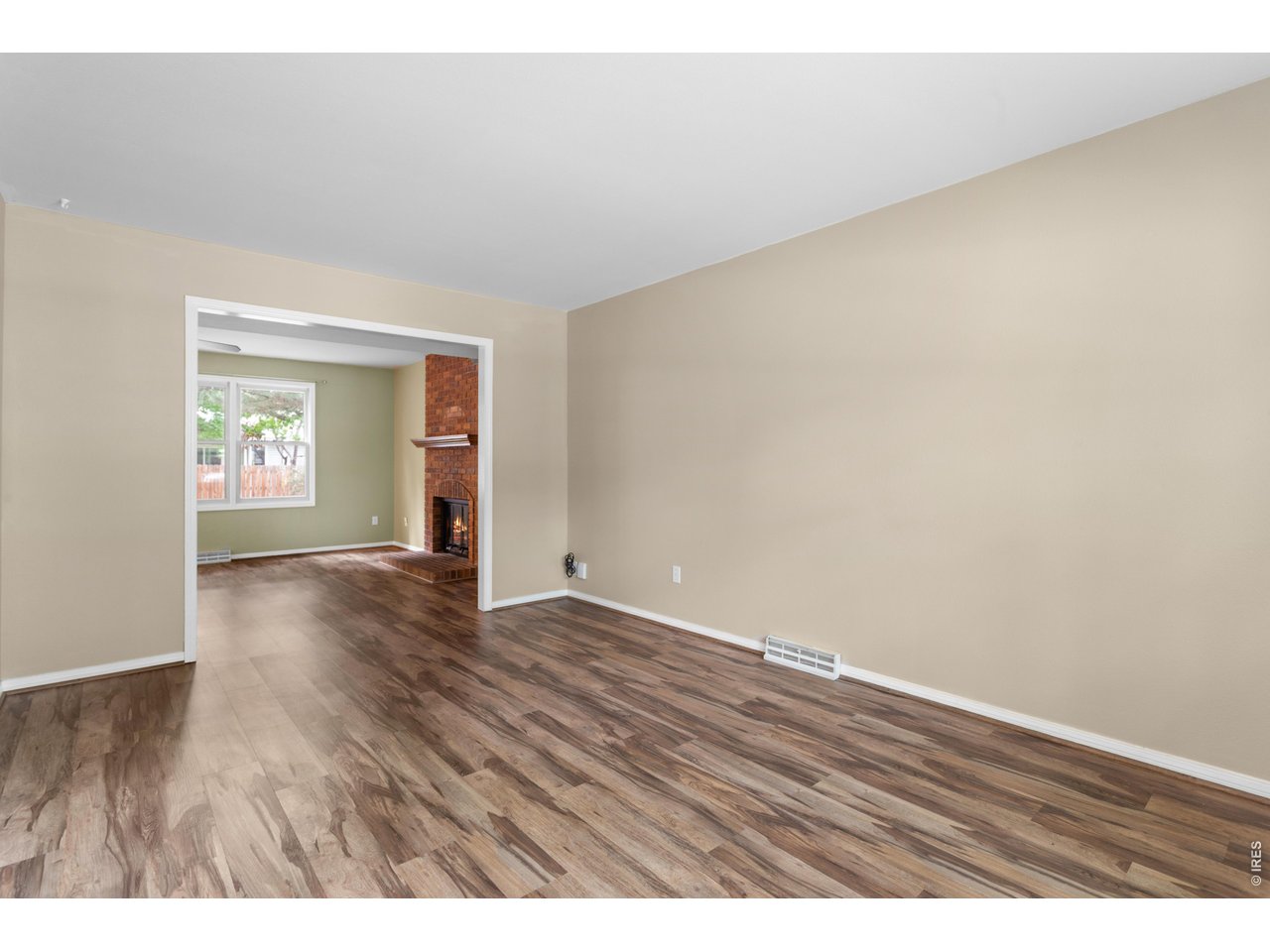 Property Photo 5 Living Room - Freshly painted and newer LVP flooring