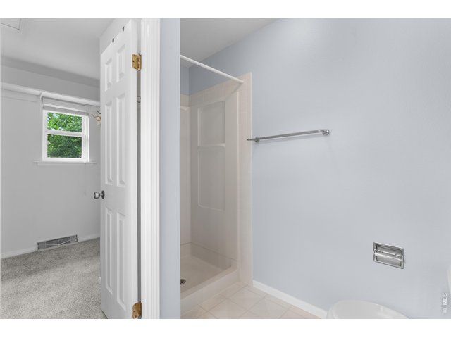 Property Photo 17 Primary Shower and Walk-in Closet