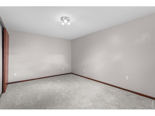 Property Photo 28 Front Basement Bedroom (non-conforming) with Closet to left