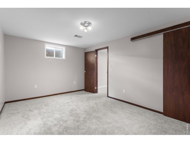 Property Photo 27 Front Basement Bedroom (non-conforming, no Egress), Closet pictured right