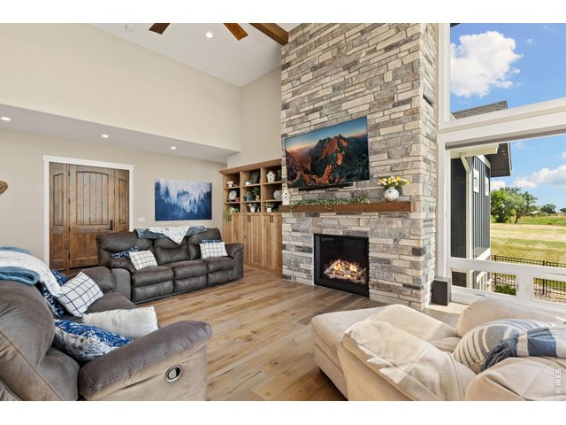 Property Photo 16 Family time centers around the beautiful stone fireplace.