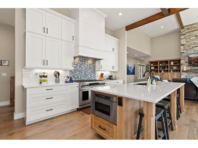 Property Photo 23 12' ceilings open up the gourmet kitchen space.