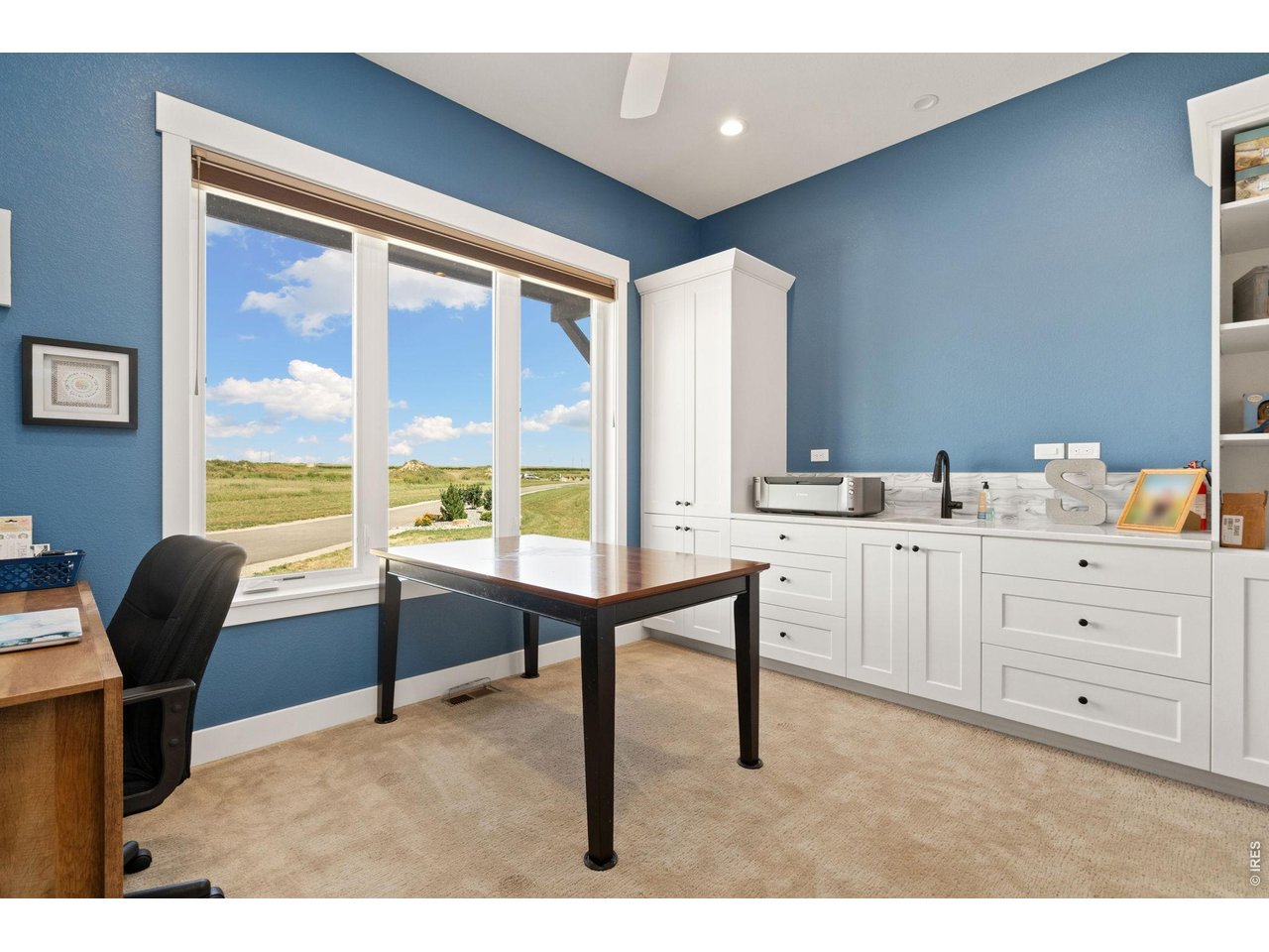 Property Photo 37 Main floor craft room/office with sink and storage!